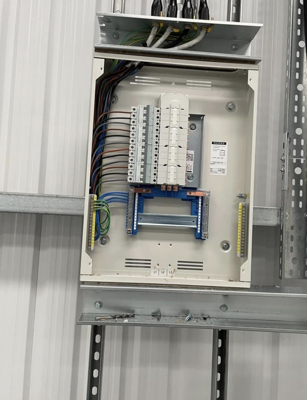 Neatly wired electrical distribution panel in an industrial setting